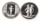 A pair of cherub buttons in black and white